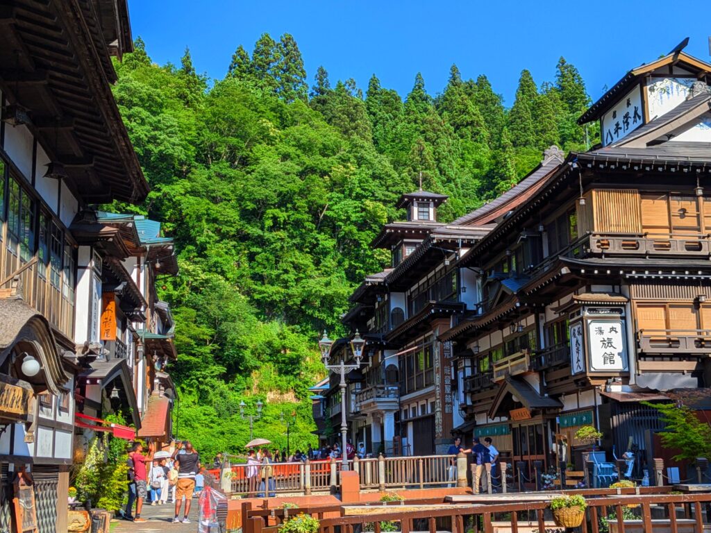 Ginzan Onsen town covered in snow, historic ryokans at night, JR Pass access